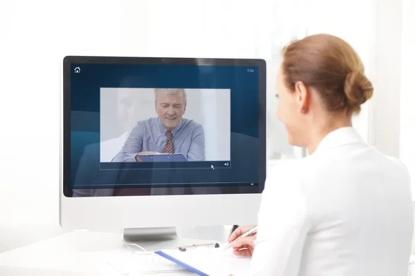 Assistant having video chat with executive businessman — Stock Photo, Image