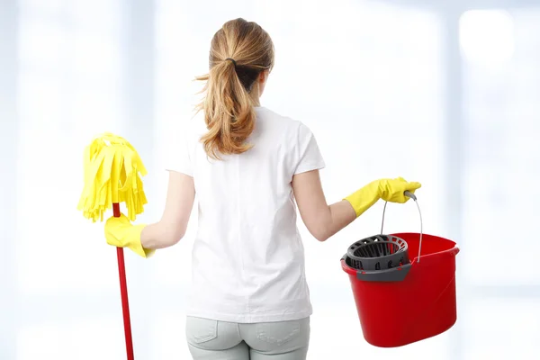 Woman holding hand a mop — Stock Photo, Image