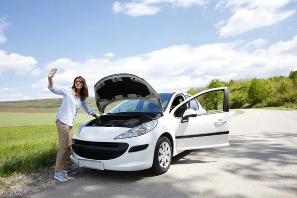 Woman waving with her hand for help. — Stock Photo, Image