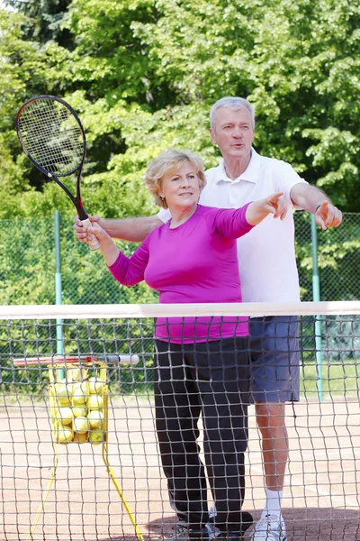 Entrenador de tenis traning con mujer — Foto de Stock