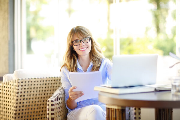 middle aged woman using laptop
