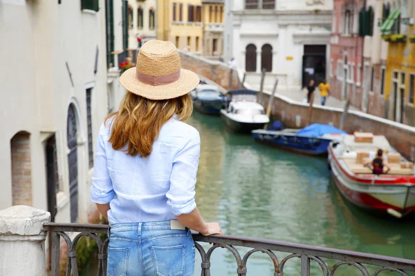 Woman standing at canal — Stock Photo, Image