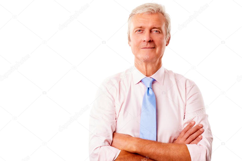 Portrait of a senior man standing with arms crossed at isolated white background with copy space. 