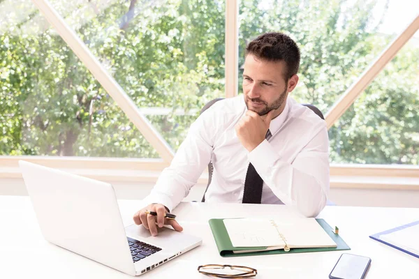 Shot Thinking Businessman Sitting His Laptop Office Desk While Working — Stock Photo, Image