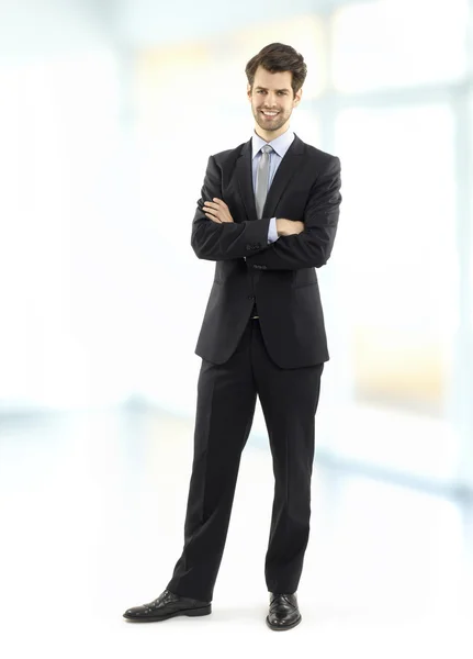 Executive businessman standing at office — Stock Photo, Image