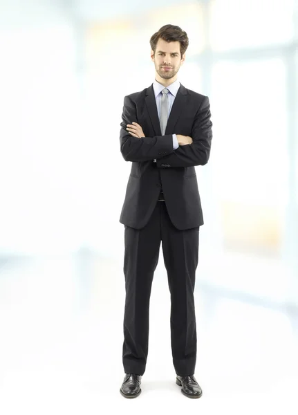 Executive businessman standing at office — Stock Photo, Image