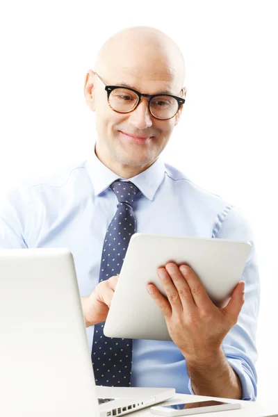 Businessman analyzing data on tablet — Stock Photo, Image