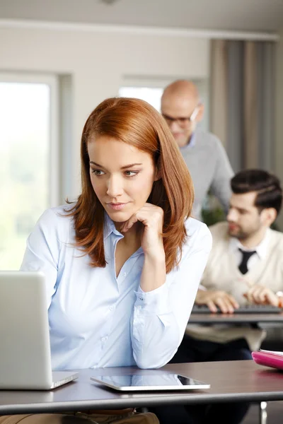 Businesswoman sitting at office — Stock Photo, Image