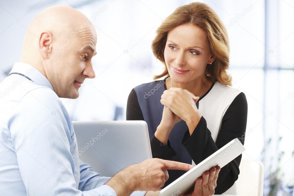 Broker presenting plan to businesswoman