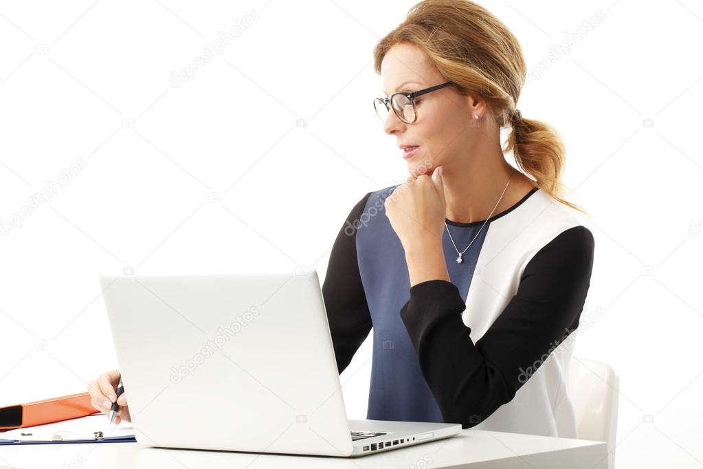 Businesswoman sitting in front of laptop