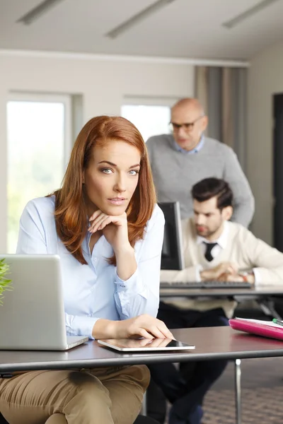 Businesswoman touching digital tablet — Stock Photo, Image