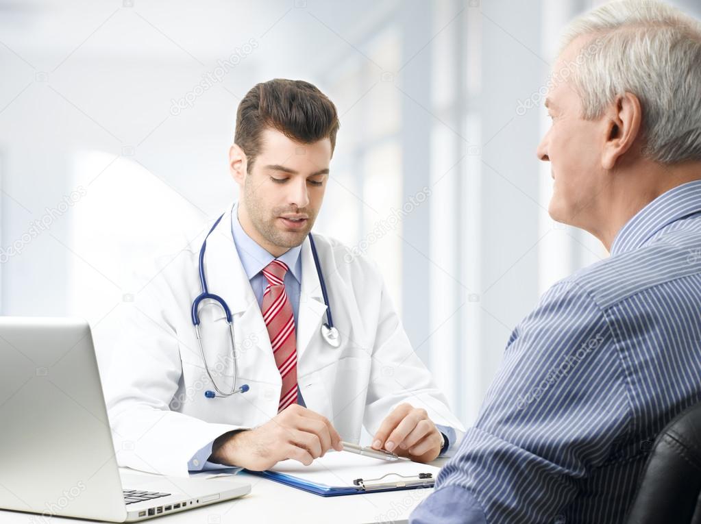 Male doctor with old patient