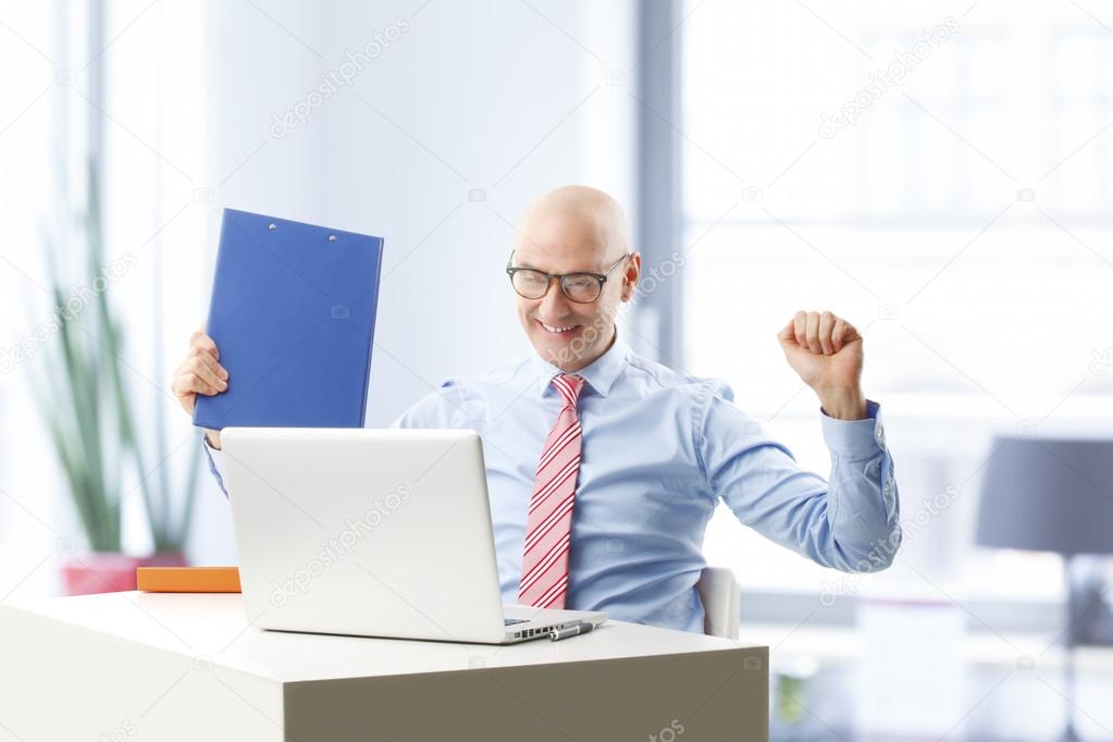 Businessman sitting in front of laptop
