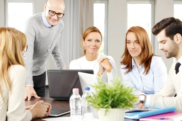 Business people sitting at meeting — Stock Photo, Image