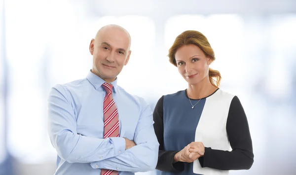 Businesswoman and businessman at office — Stock Photo, Image