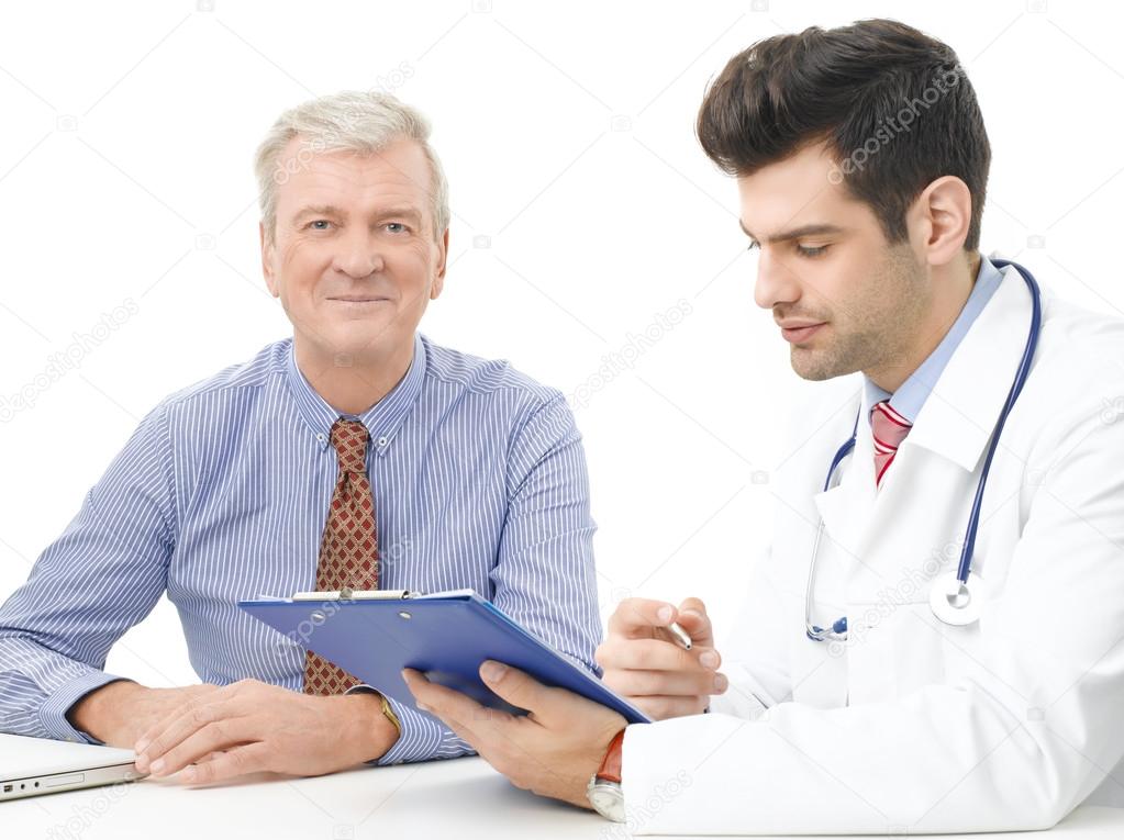 Male doctor with elderly patient