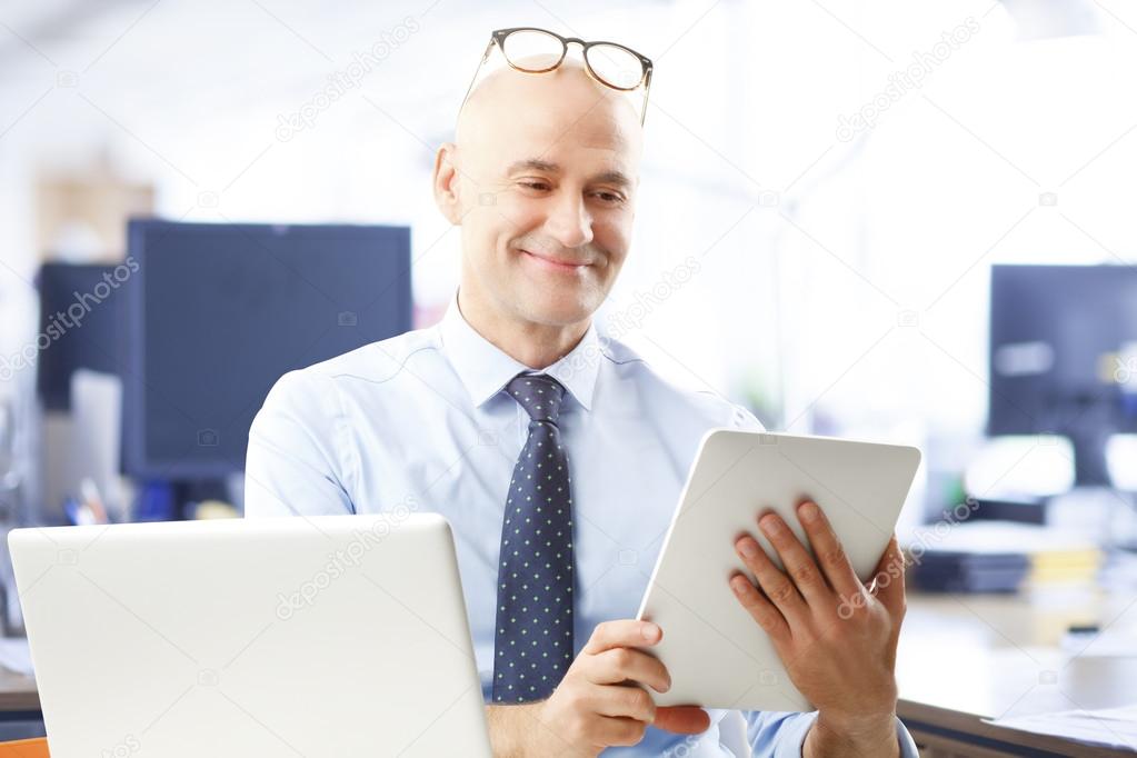 Businessman holding digital tablet