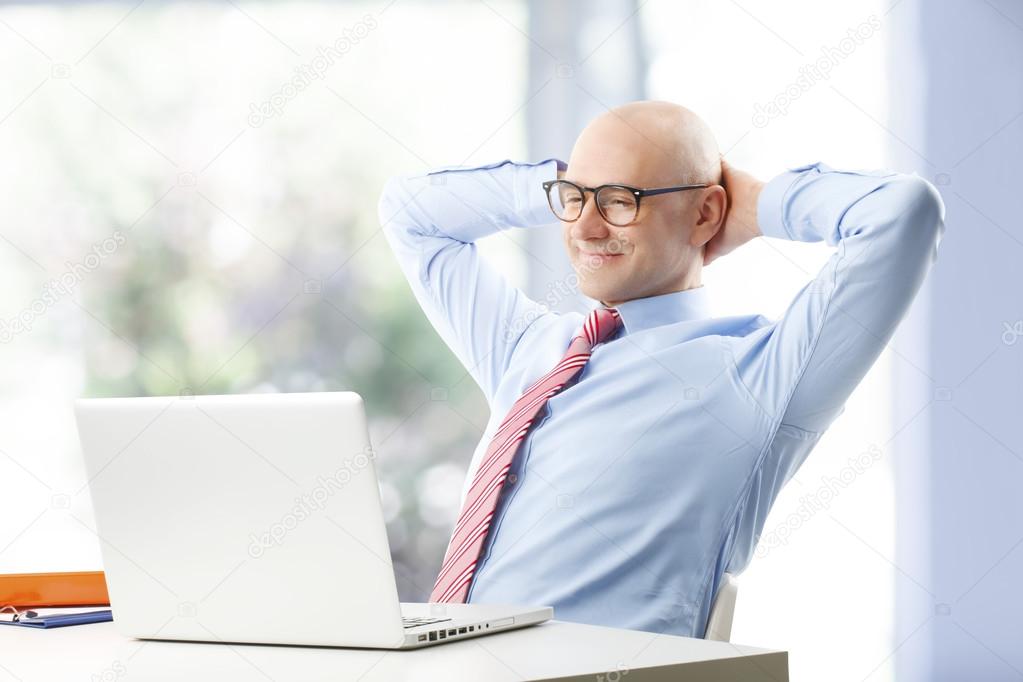 Businessman with laptop at office