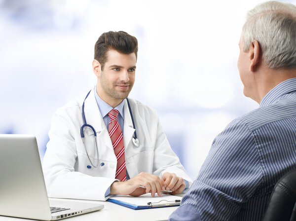 Young doctor with patient
