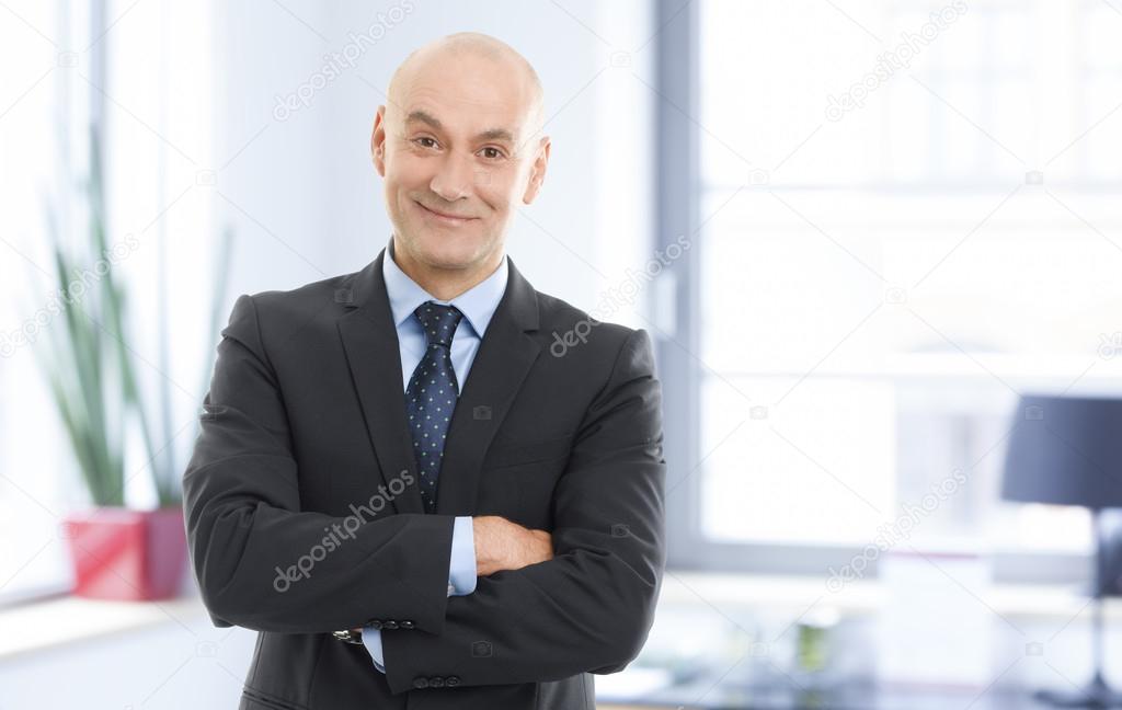 Successful businessman with arms crossed