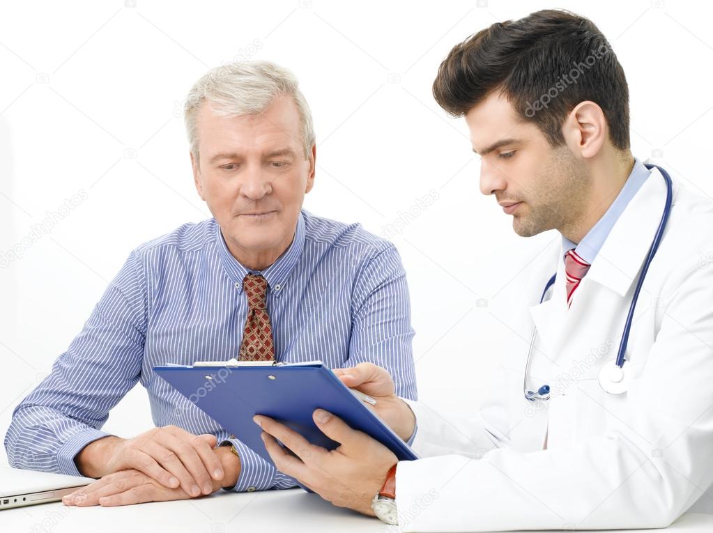 Young doctor with elderly patient