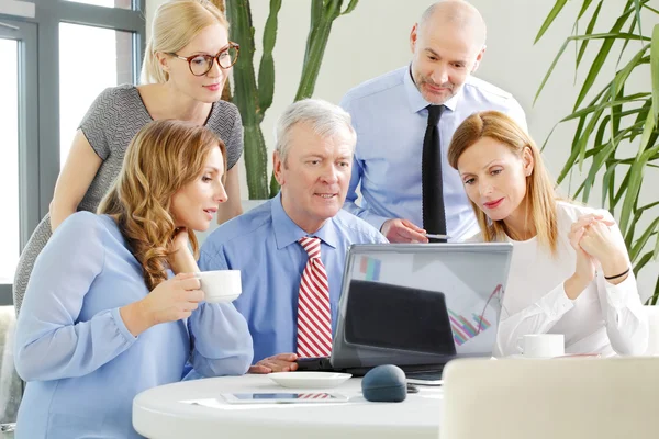 Business people around conference table — Stock Photo, Image