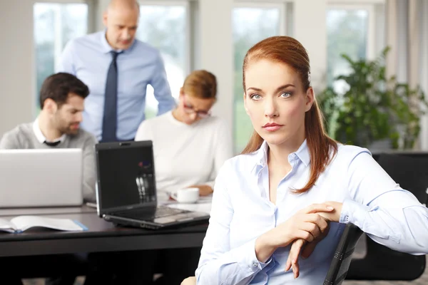 Businesswoman sitting at office — Stock Photo, Image