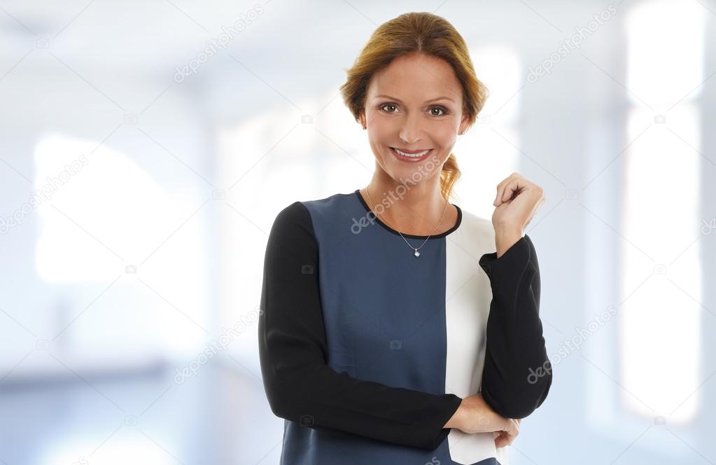 Attractive businesswoman standing at office