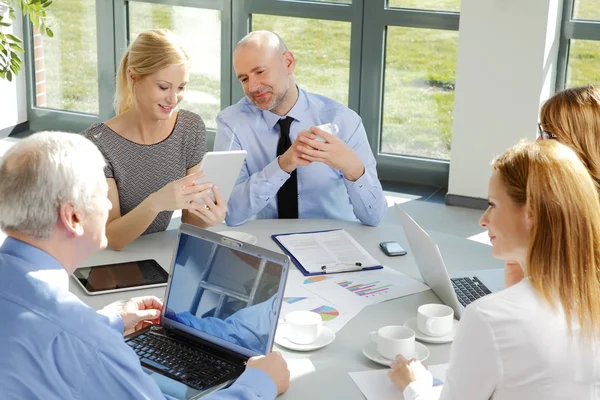 Business people sitting at office — Stock Photo, Image