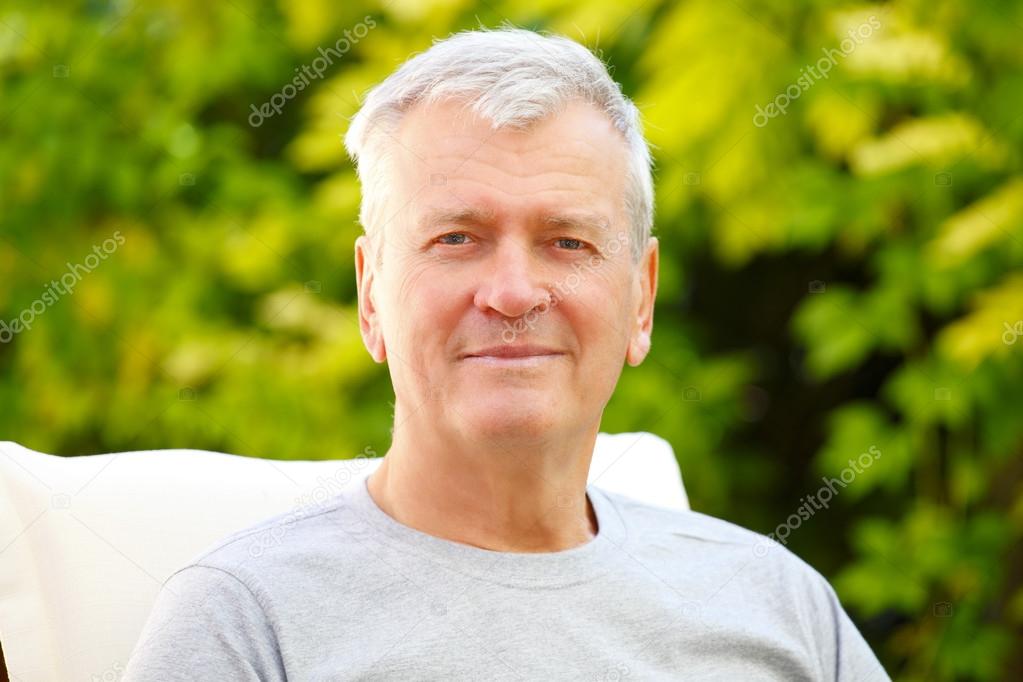 senior man sitting at garden