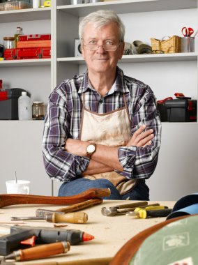 carpenter sitting at his workshop