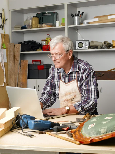 Carpenter sitting at his workshop — Stock Fotó