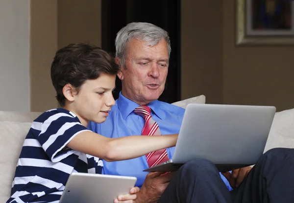 Grandson teaching grandfather — Stok fotoğraf