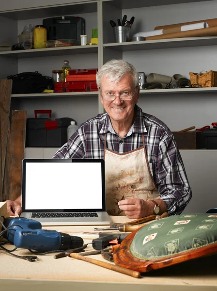 Craftsman in his workshop — Stok fotoğraf