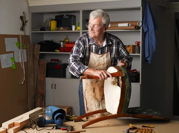 Carpenter sitting at his workshop — Stockfoto