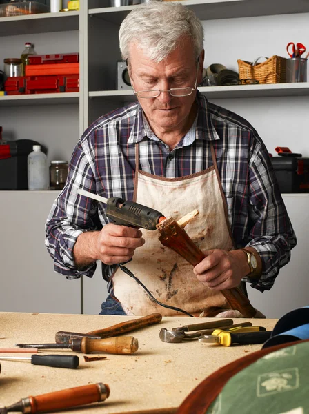 Carpenter sitting at his workshop — Stock fotografie