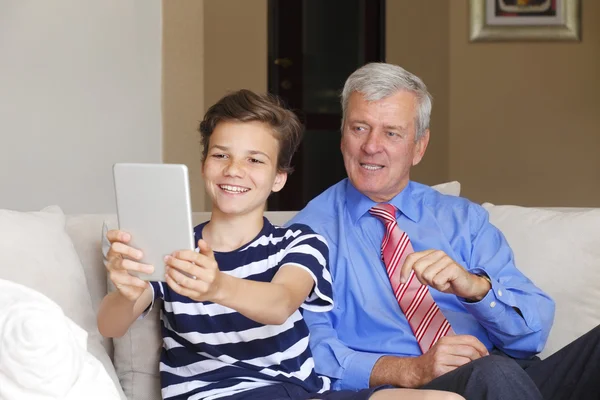 Grandfather with his grandson taking self-portrait — Stok fotoğraf