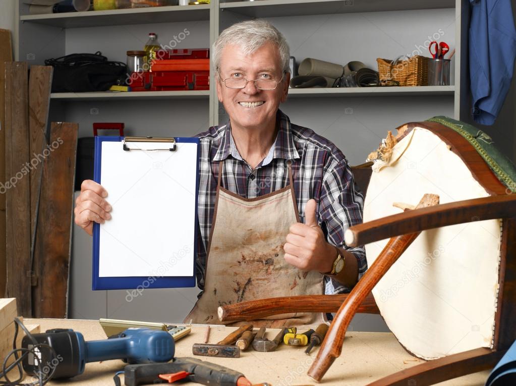 carpenter sitting at his workshop