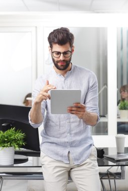 sales man sitting at office desk