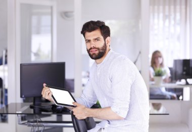 handsome businessman sitting at office