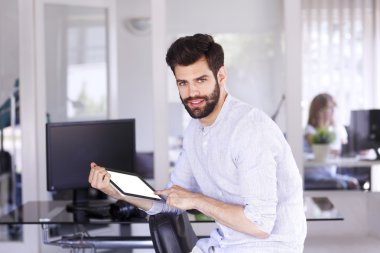 handsome businessman sitting at office