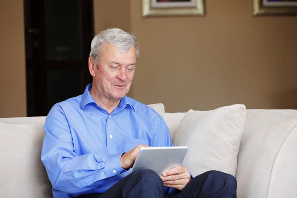 Businessman sitting at home — Stock Photo, Image