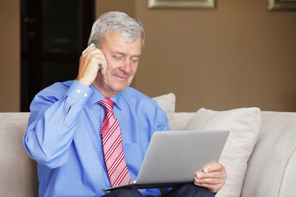 Retired man sitting at home — Stock Photo, Image