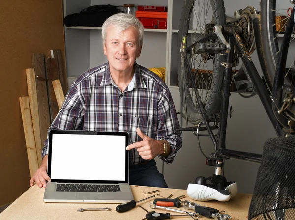 Senior bike shop owner — Stock Photo, Image