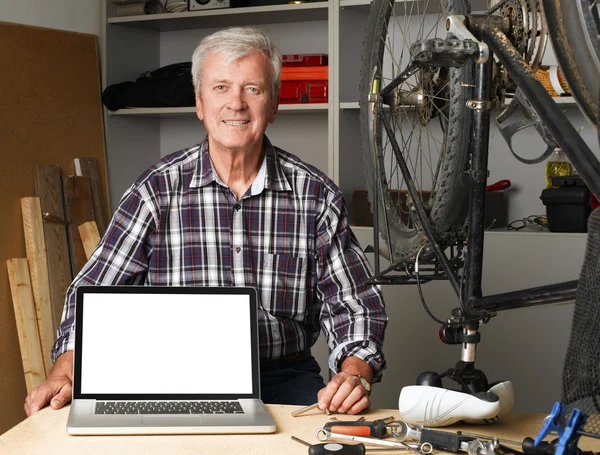 Senior bike shop owner — Stock Photo, Image