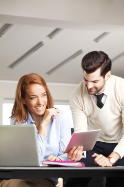 businessman consulting with executive businesswoman