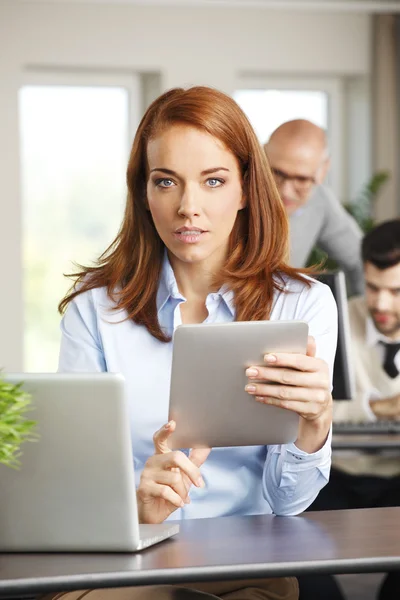 Sales woman behind laptop — 스톡 사진