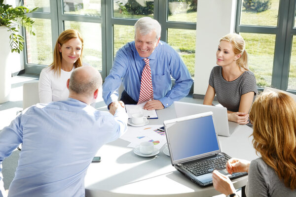 Business people around conference table