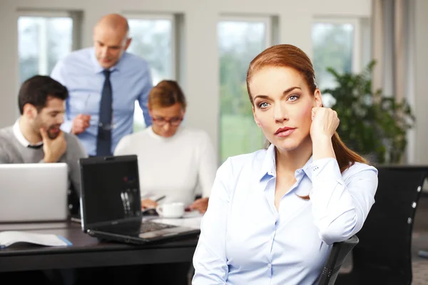 Middle age businesswoman sitting — Stock Photo, Image