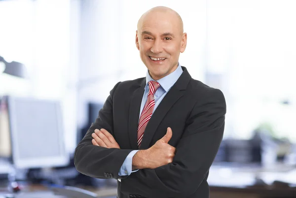 Businessman standing at office — Stock Photo, Image
